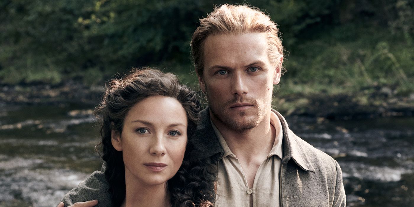 Clare and Jamie looking at the camera in Outlander.