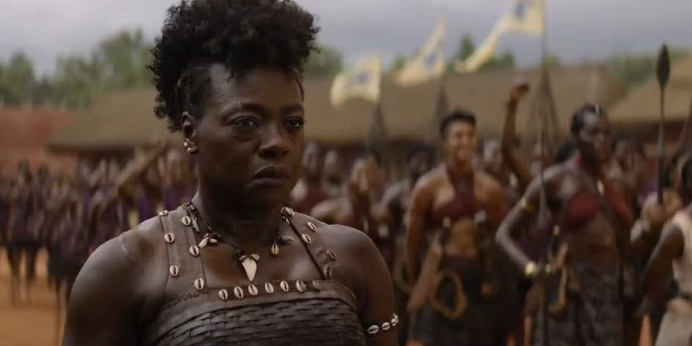 Nanisca with the Dahomey behind her in The Woman King.