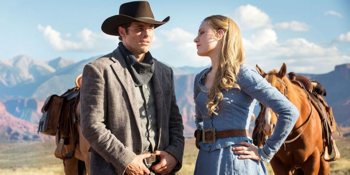 Evan Rachel Wood as Dolores and James Marsden as Teddy standing by their horses in Westworld Season 1 Episode 1
