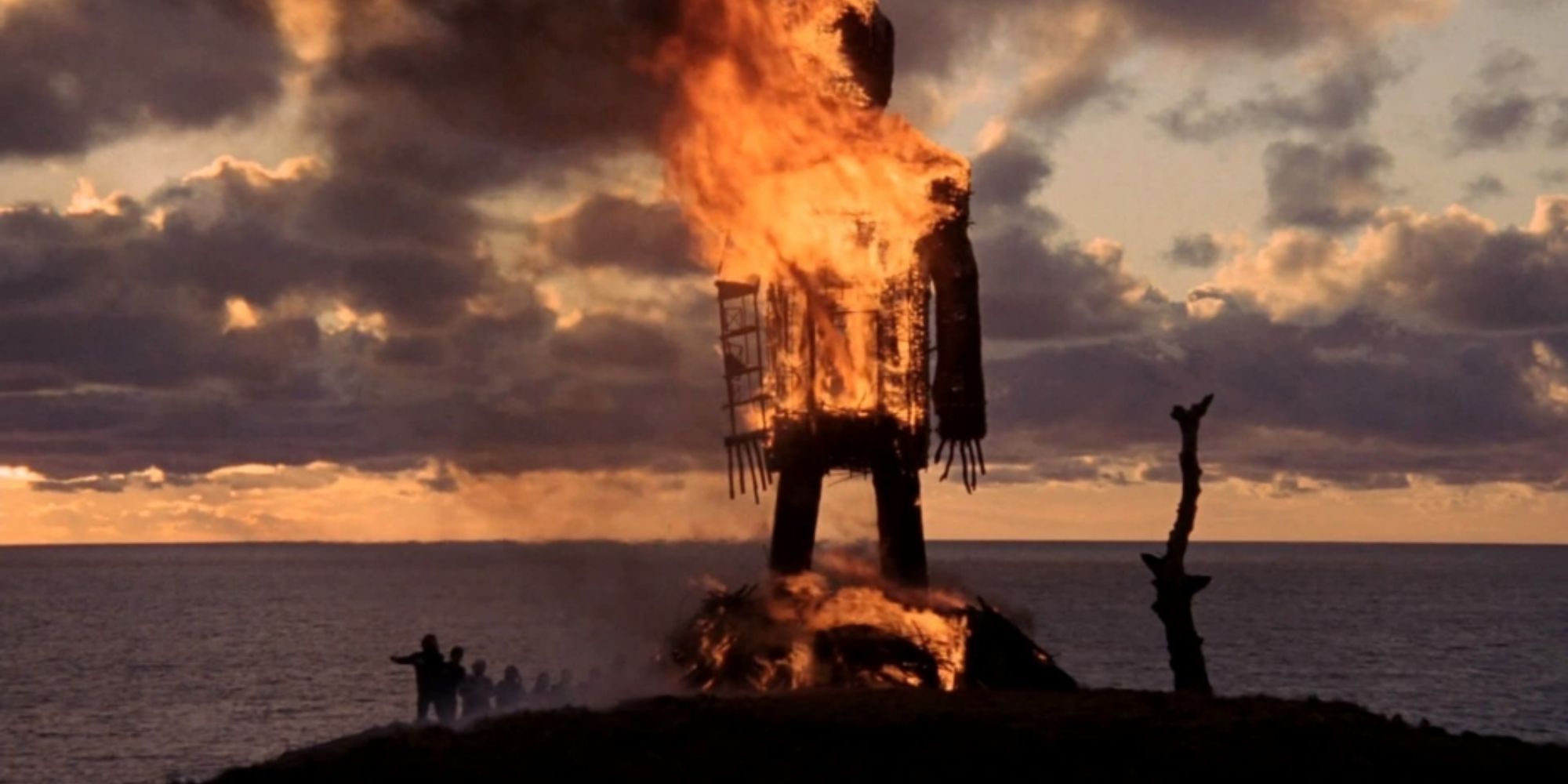 The wicker man burns as onlookers watch