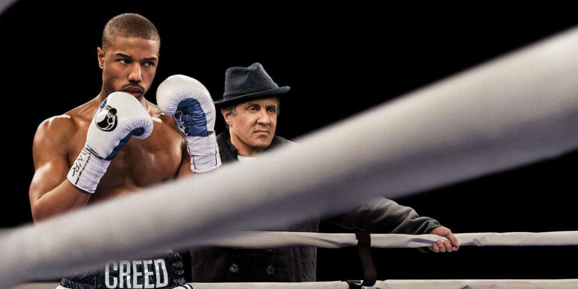 Michael B. Jordan in the ring, followed by Sylvester Stallone in Creed