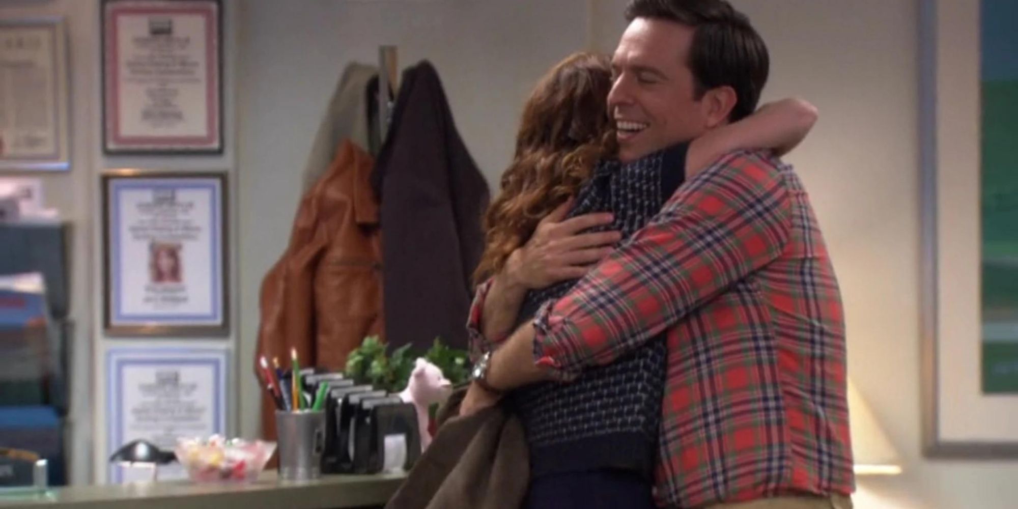 Andy and Erin from The Office hugging