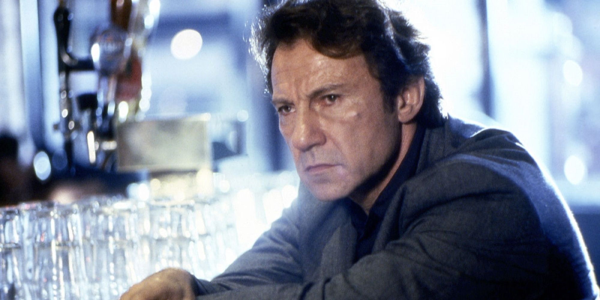 Harvey Keitel sitting at a bar looking miserable in 'Bad Lieutenent.'