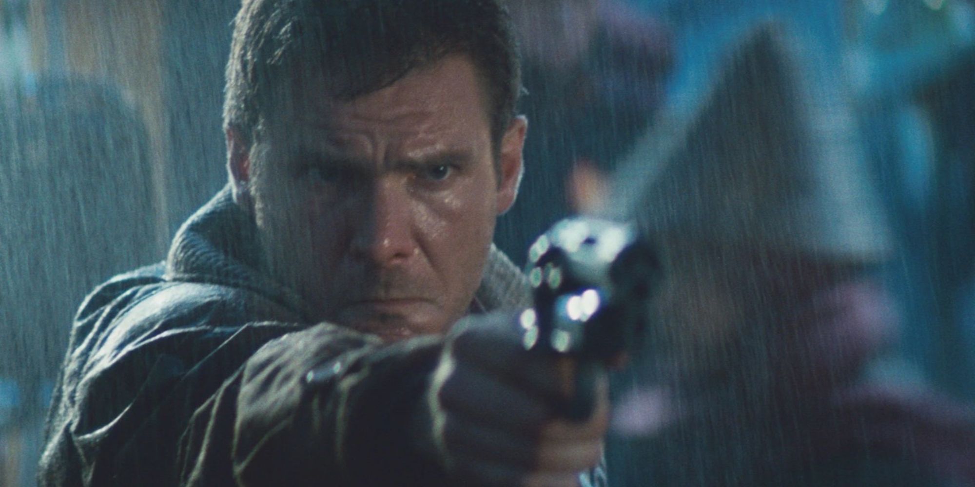 Rick Deckard standing in the rain pointing a gun at someone off camera in Blade Runner