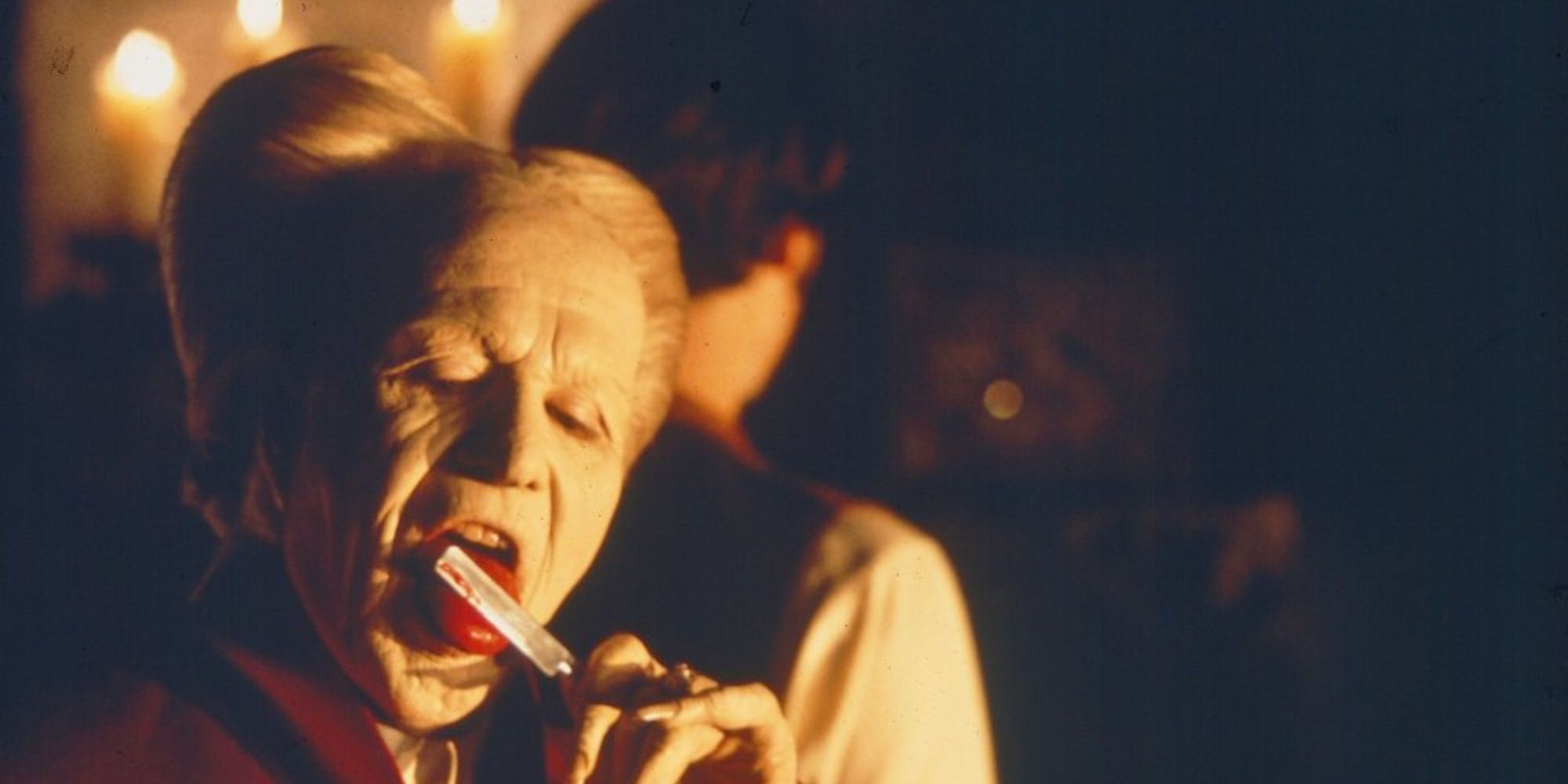 Gary Oldman as Count Dracula licking a razorblade with blood in Bram Stoker's Dracula (1992)