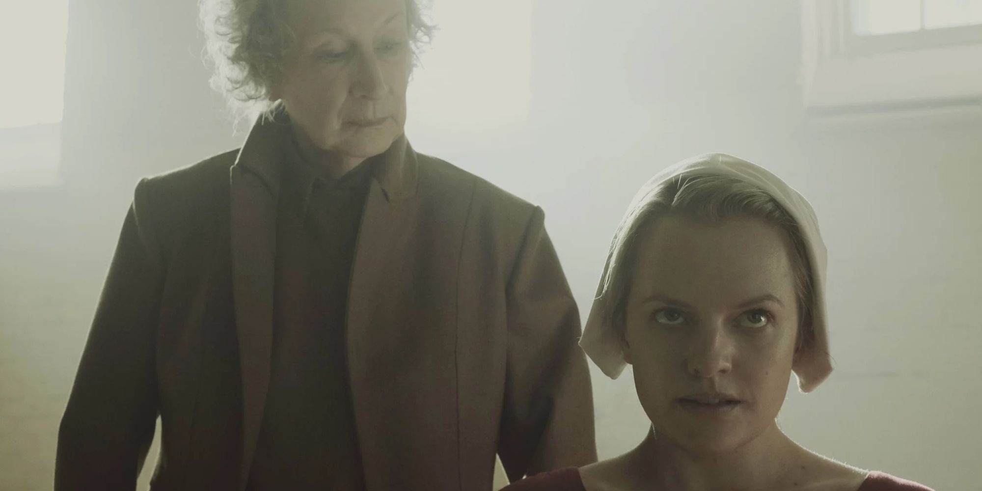 Margaret Atwood as an Aunt, standing behind Offred