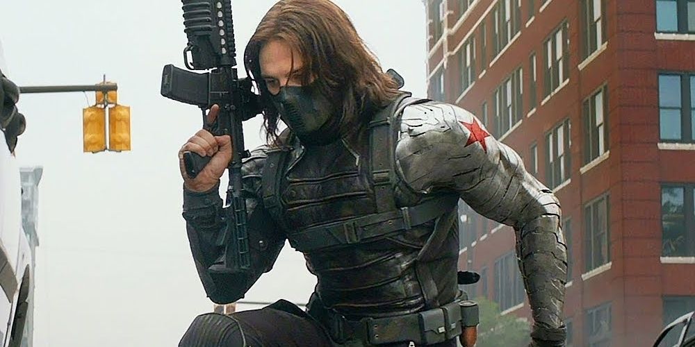 Sebastian Stan as Bucky carrying a gun in Captain America: The Winter Soldier