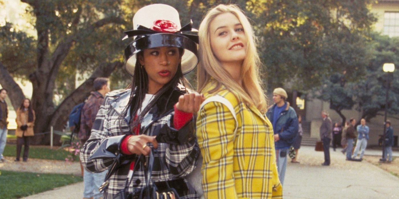 Dionne and Cher stand together out the front of their high school in Clueless.