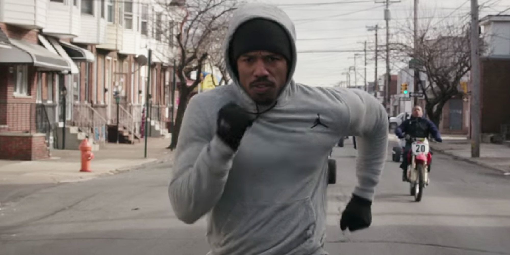 Michael B. Jordan as Creed running in training