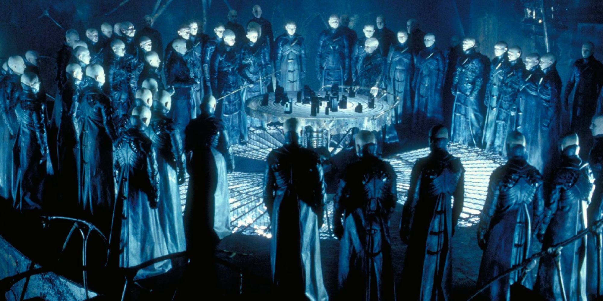 A group of white-faced peiple in a circle in Dark City - 1998