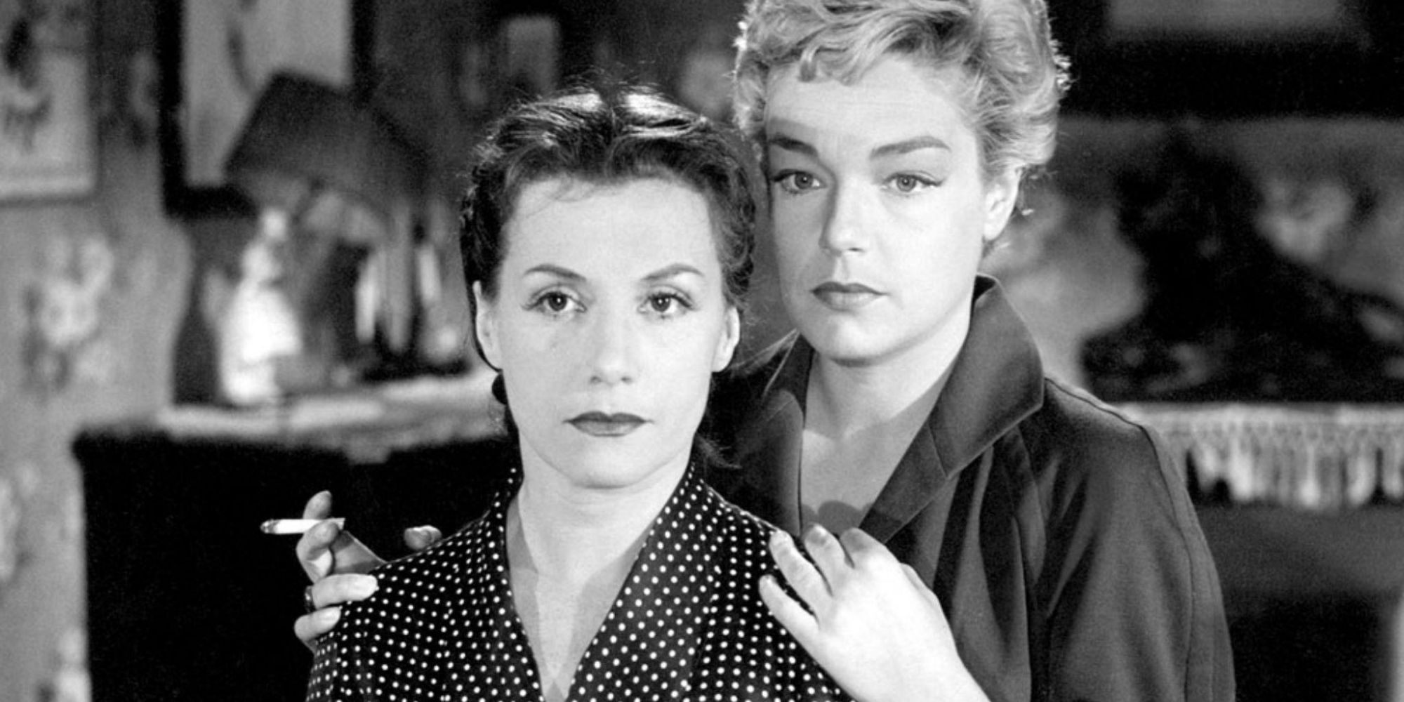Vera Clouzot and Simone Signoret as Christina and Nicole standing close to each other in Diabolique (1955)