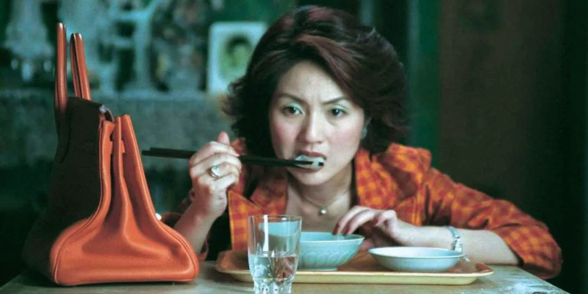 A still of Mrs Li eating dumplings in Dumplings (2004)