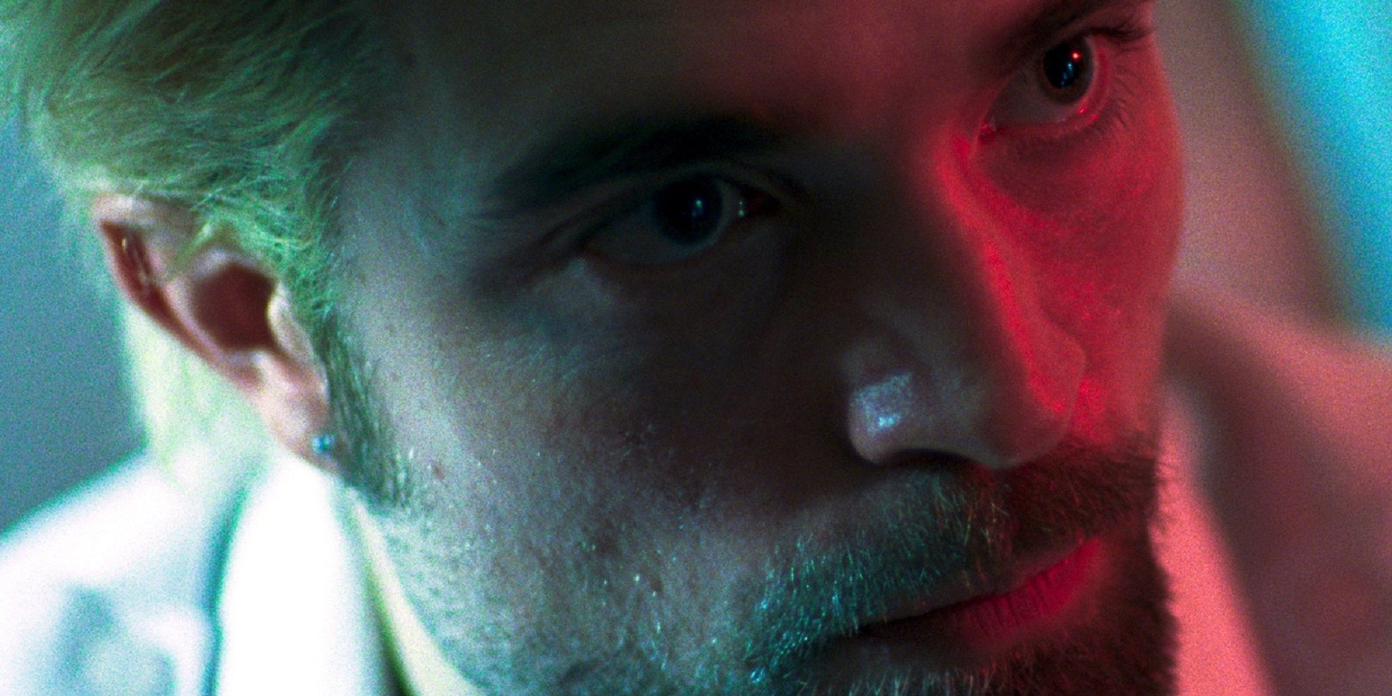 Robert Pattinson under neon lights after bleaching his hair blonde in &lsquo;Good Time.'
