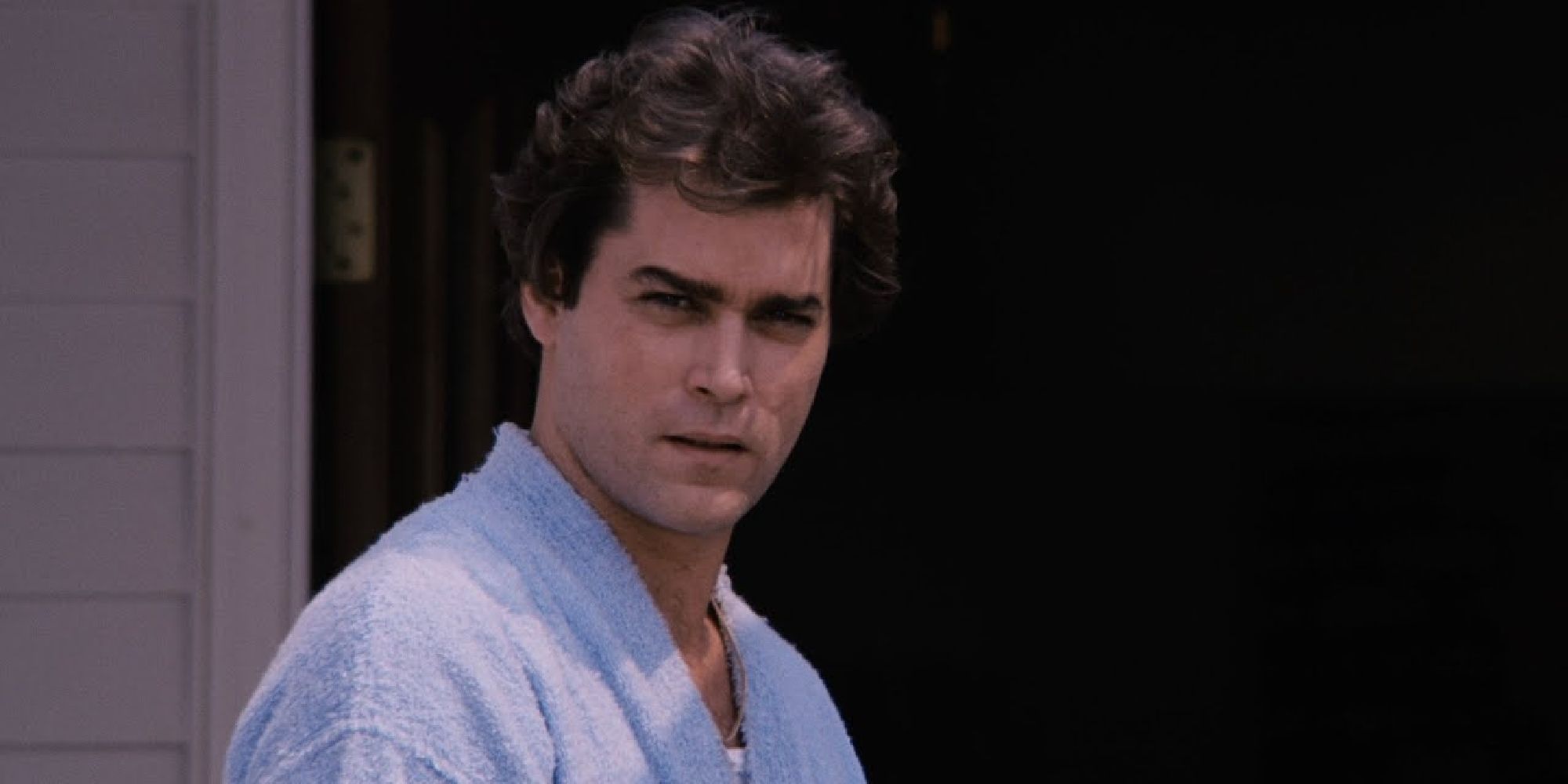 Ray Liotta as Henry Hill standing on his front lawn in Goodfellas