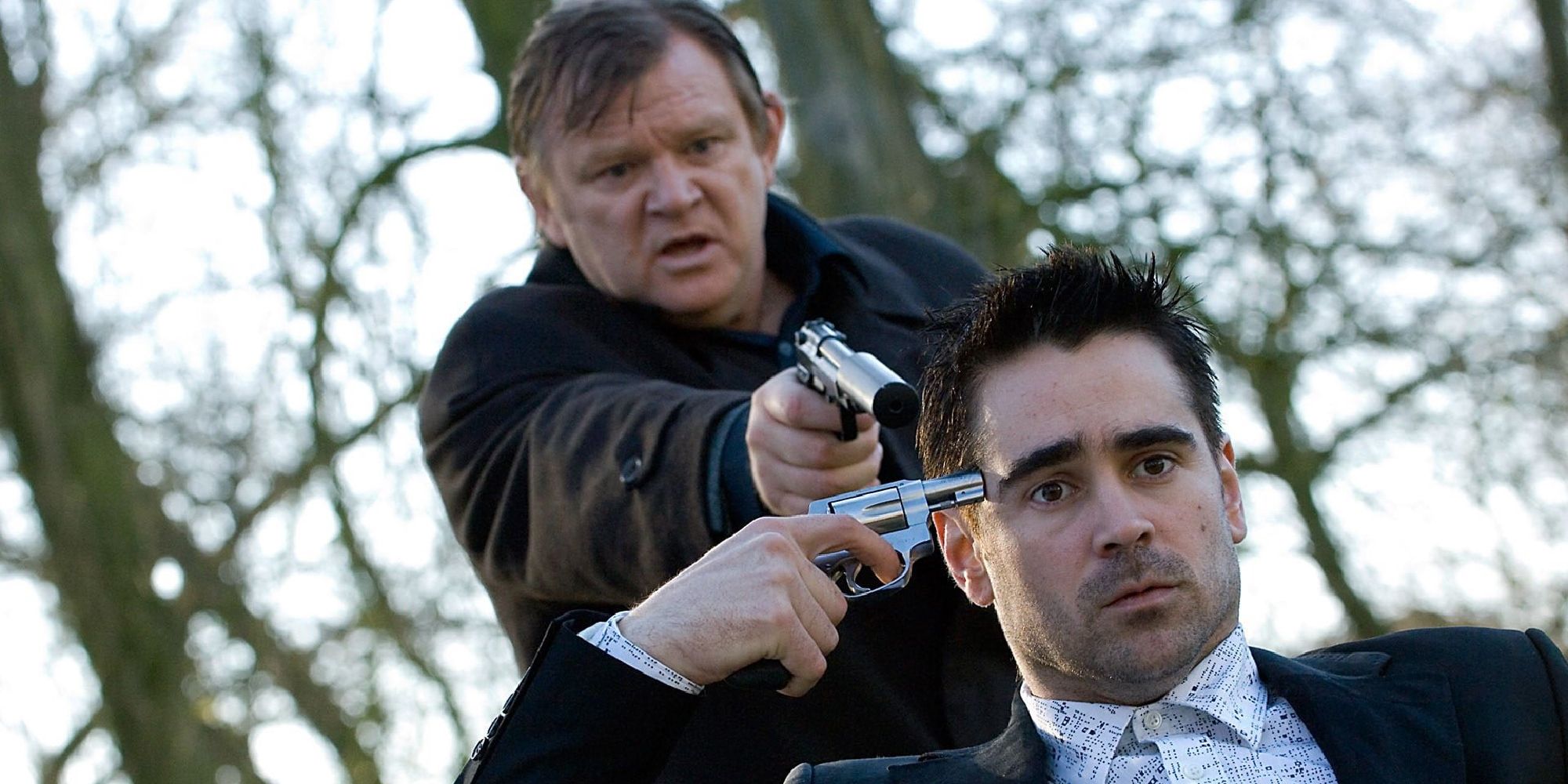 Ray with a gun to his head and Ken with a gun to Ray's head in 'In Bruges'