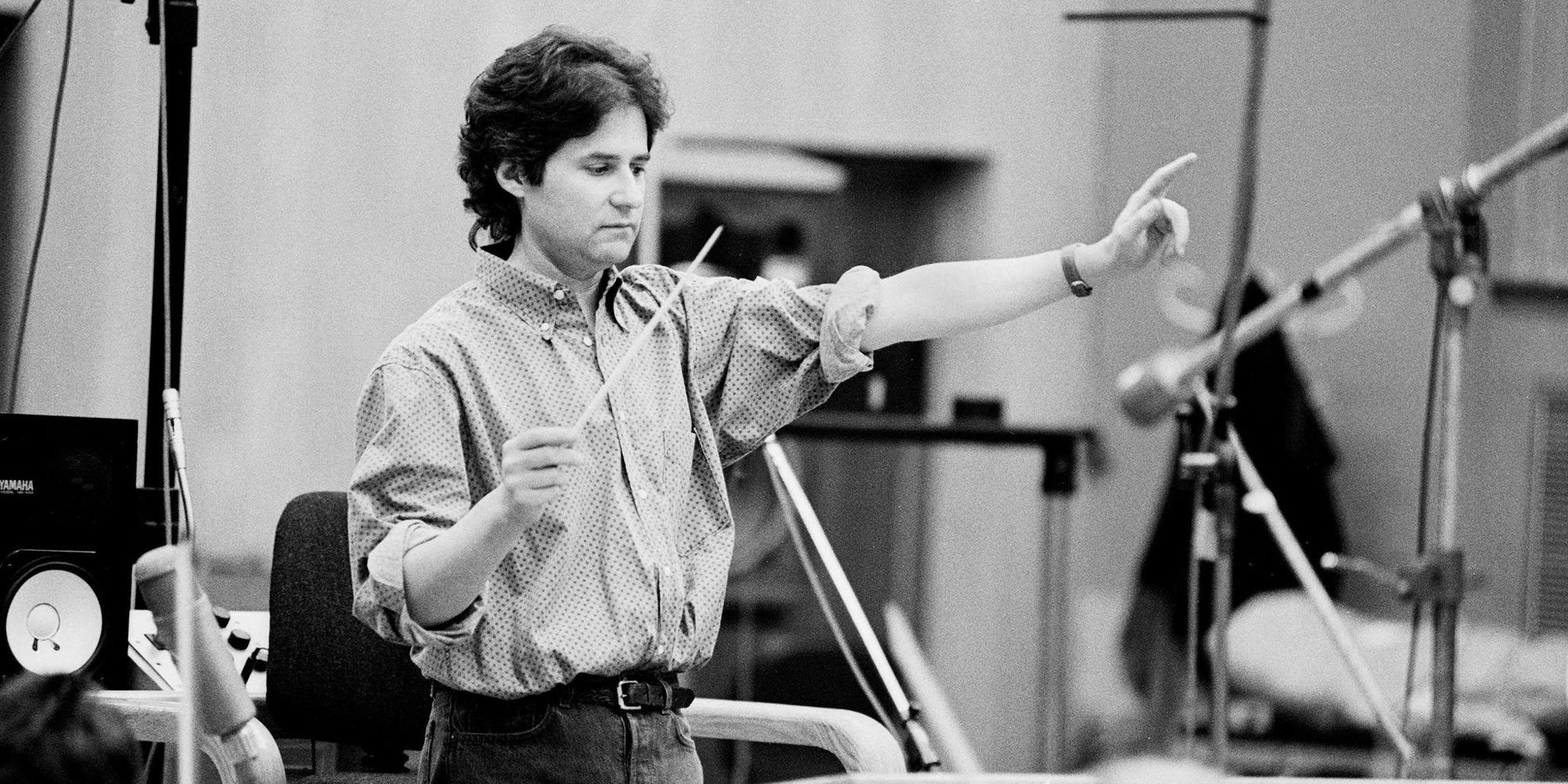 James Horner conducting in a studio, in black and white