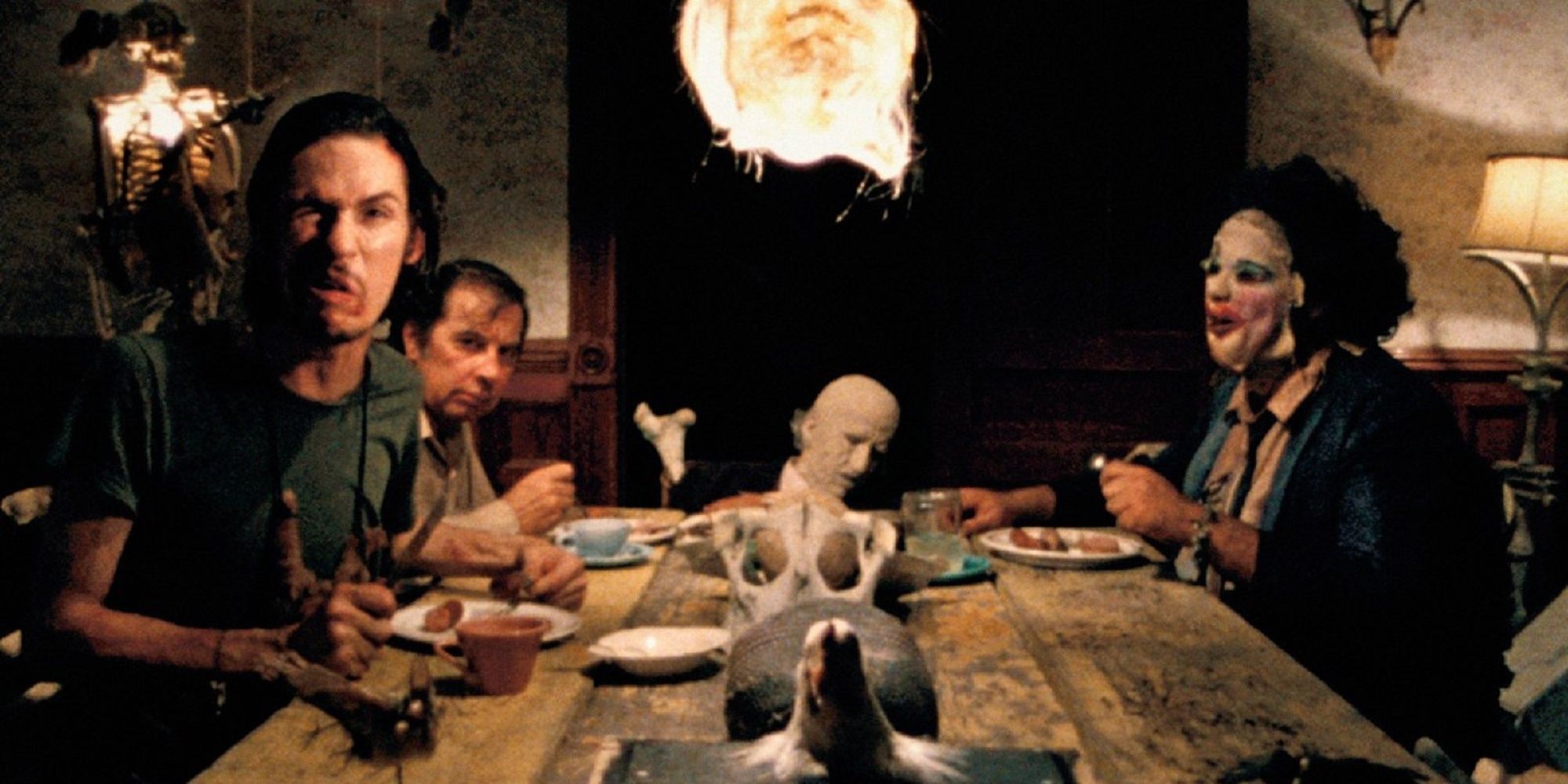 The Saywer family sitting around the table to eat dinner in 'The Texas Chainsaw Massacre.'