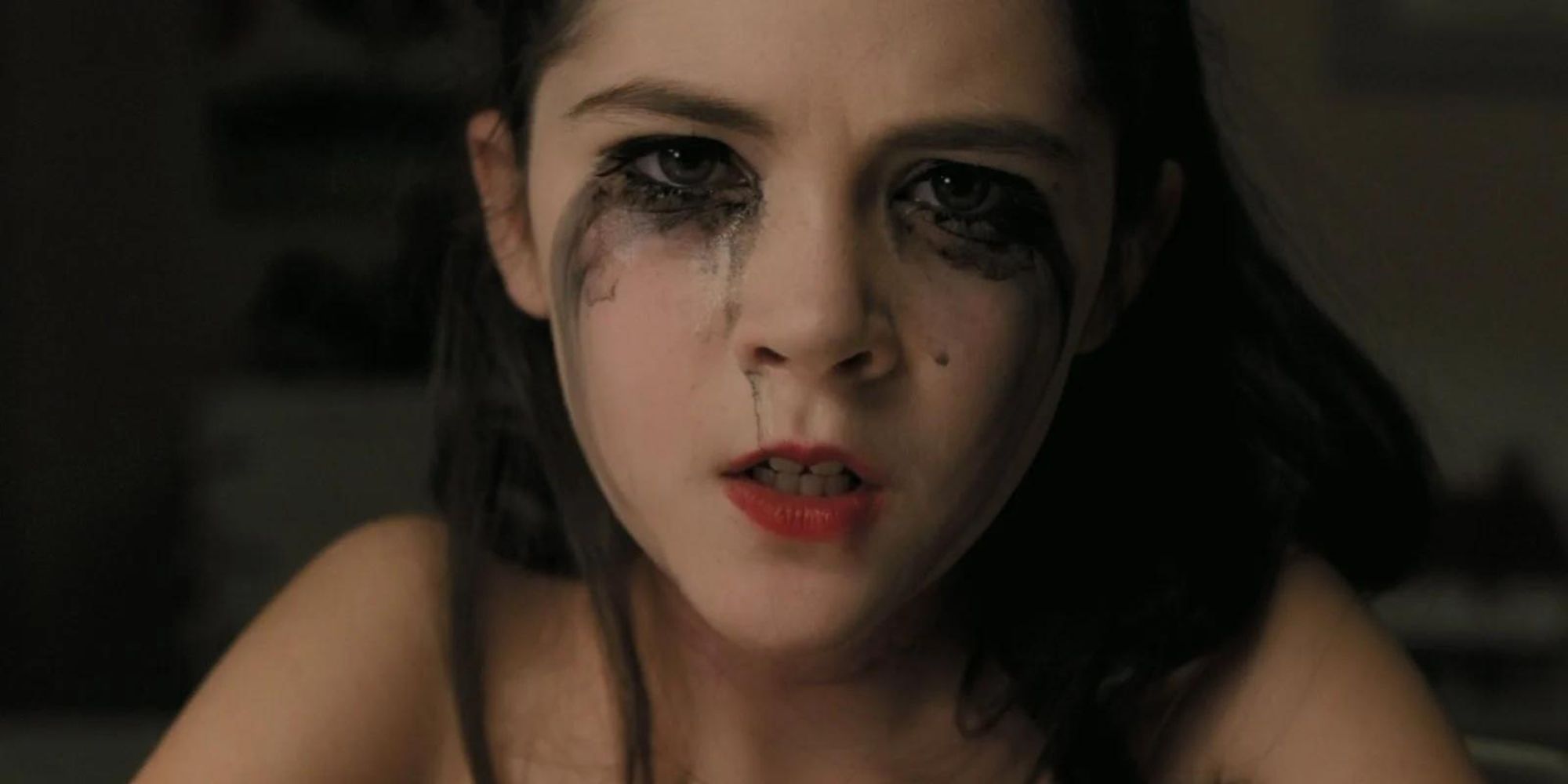 Isabelle Fuhrman as Esther crying with mascara running down her face in Oprhan.