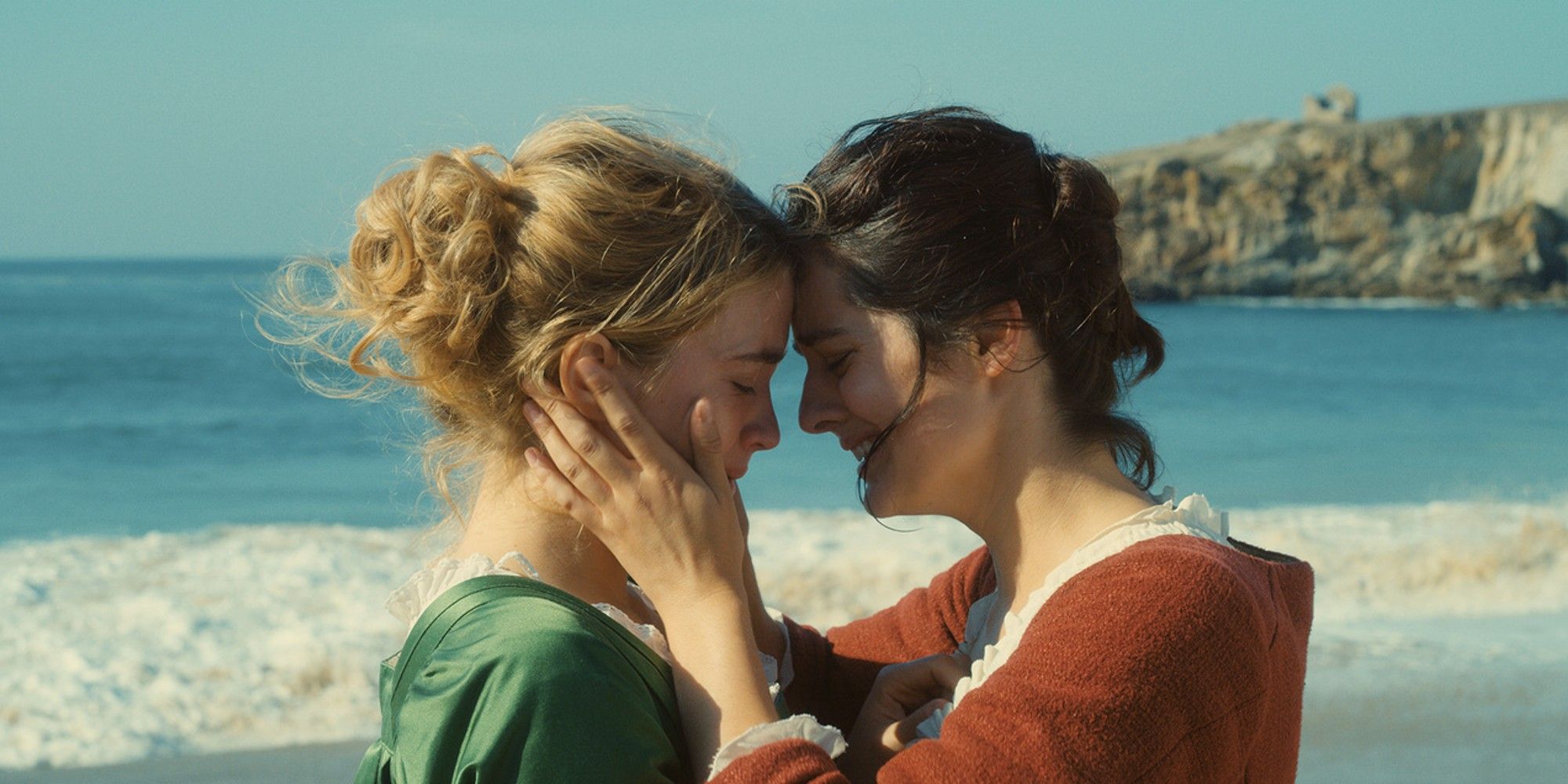 Noémie Merlant holding Adèle Haenel's face in 'Portrait of a Lady on Fire'