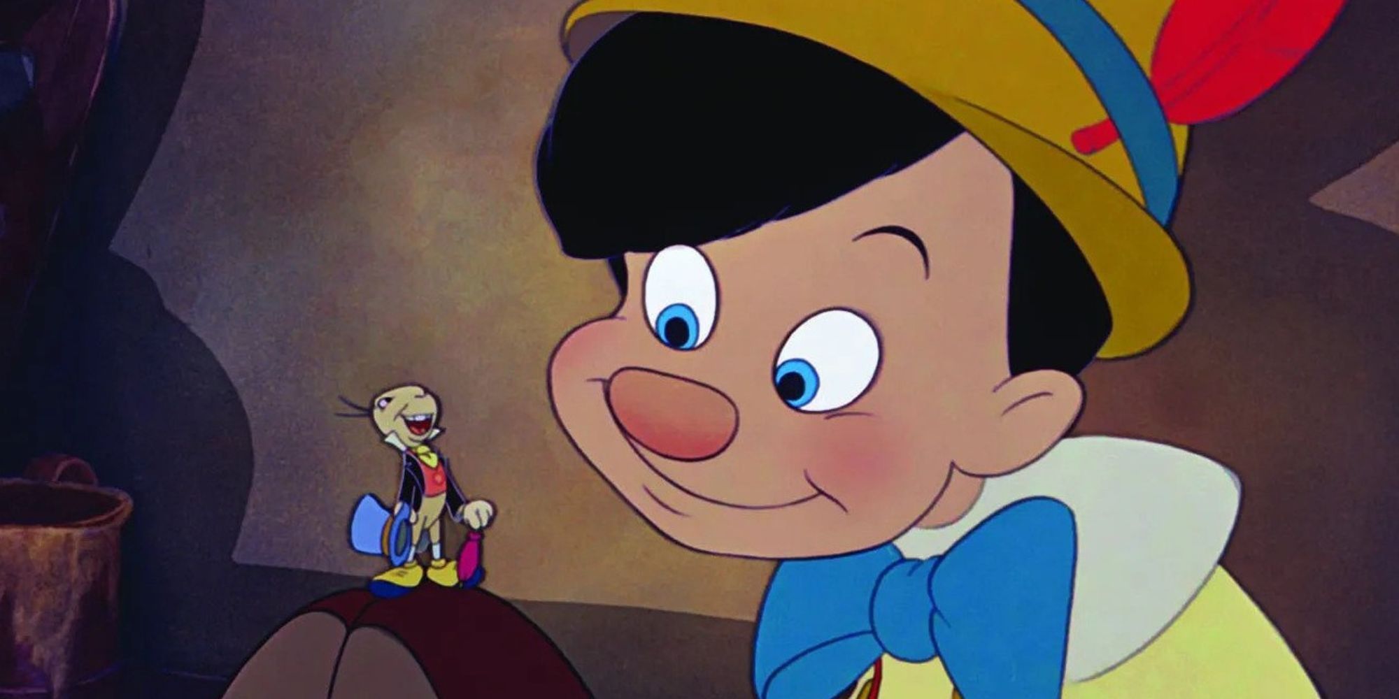Pinocchio looking at Jiminy Cricket, who's standing on his knee, in Pinocchio