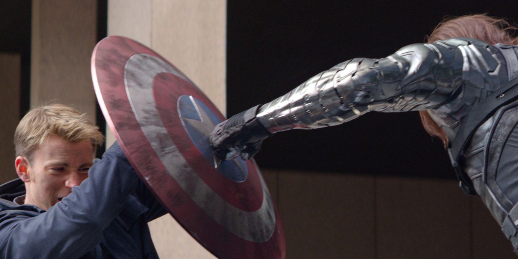 The Winter soldier punches Captain America's shield