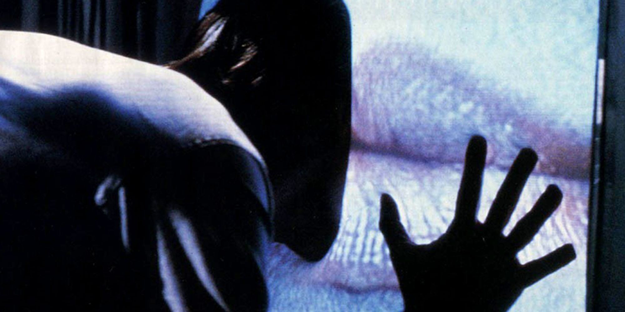 A man mergeing with a television airing a woman&rsquo;s lips in Videodrome (1983)