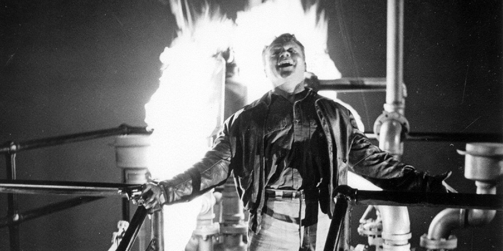James Cagney standing on top of a burning tank in White Heat - 1949