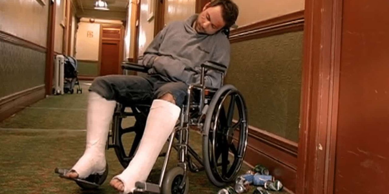 charlie in wheelchair asleep outside his apartment always sunny