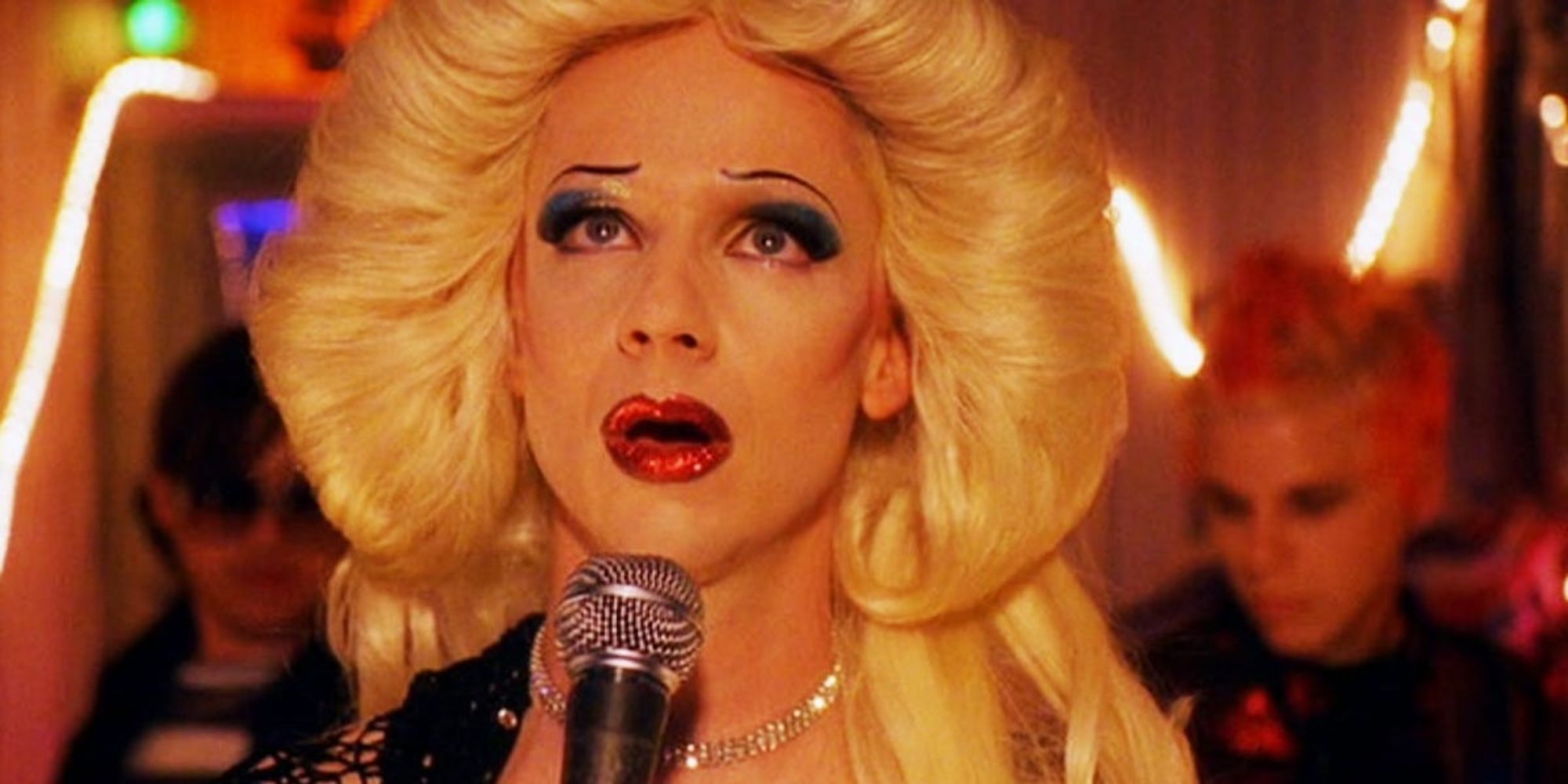 Hedwing singing into a microphone in Hedwig and the Angry Inch.