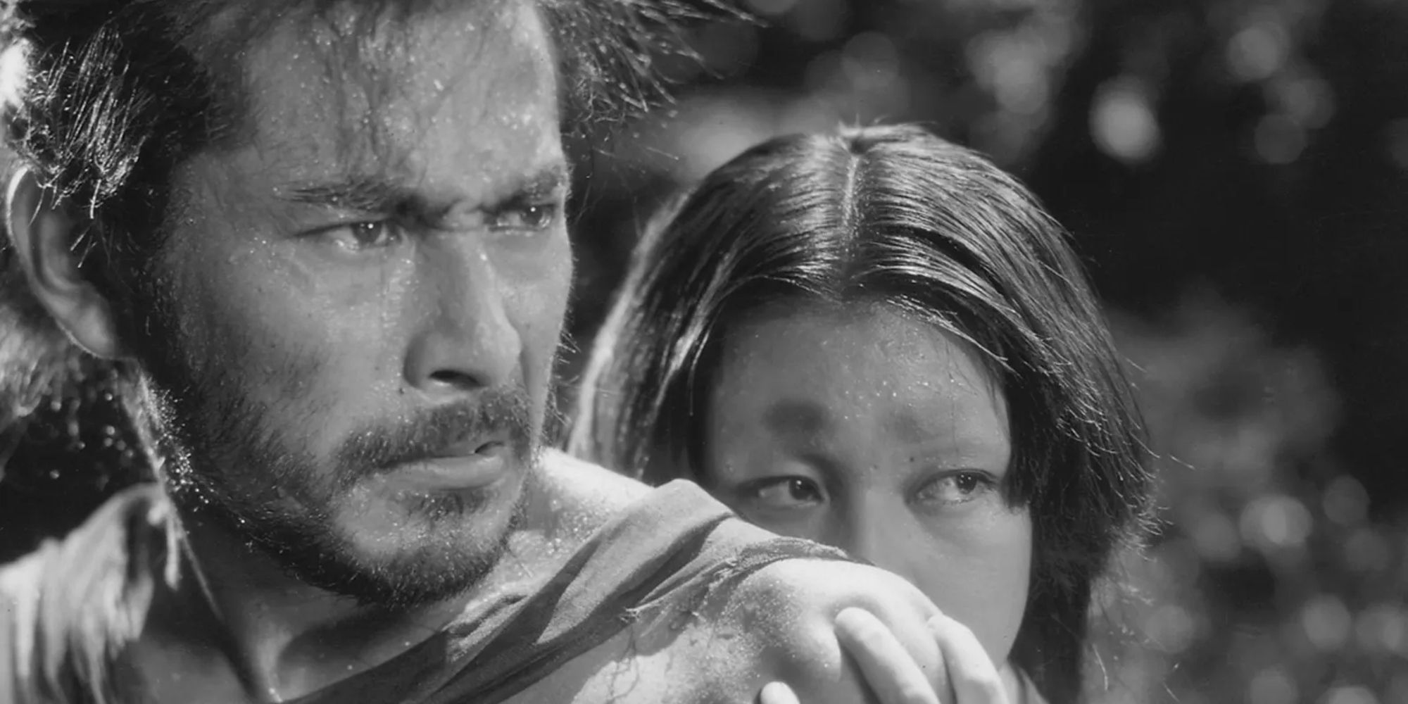 "The Bandit" and "The Woman" look angrily in 'Rashomon'