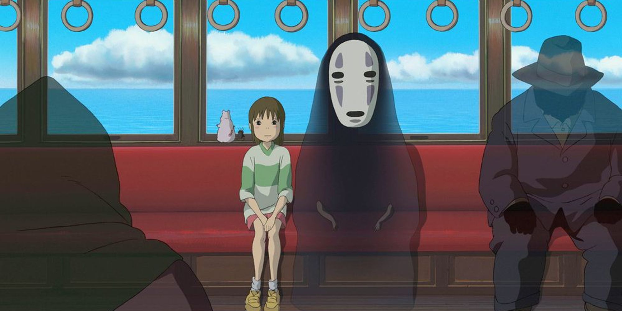 Chihiro and No-Face sitting among spirits in a train in Spirited Away