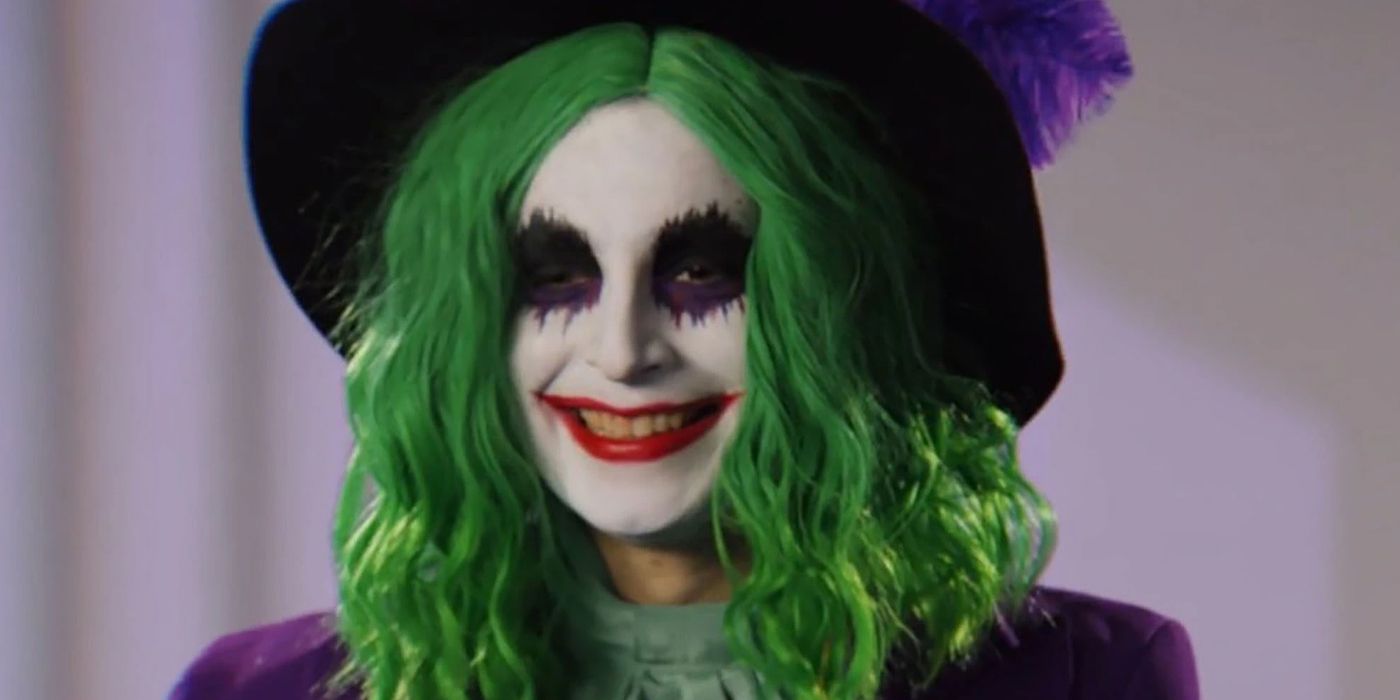 Someone in Joker makeup with a green wig in The People's Joker