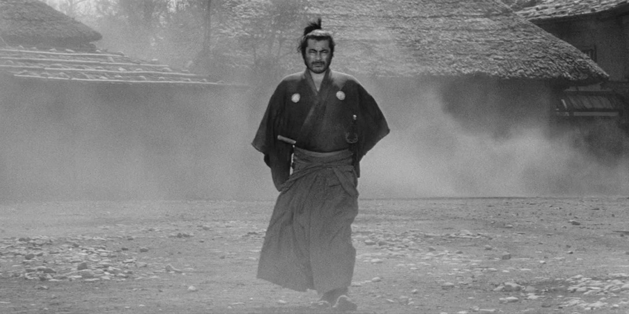 A man walking through the mist in Yojimbo