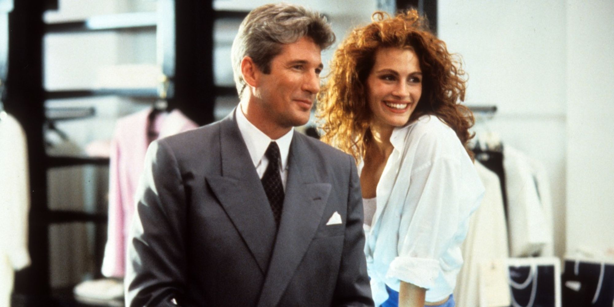 Edward and Vivian smiliing while looking ahead in Pretty Woman.