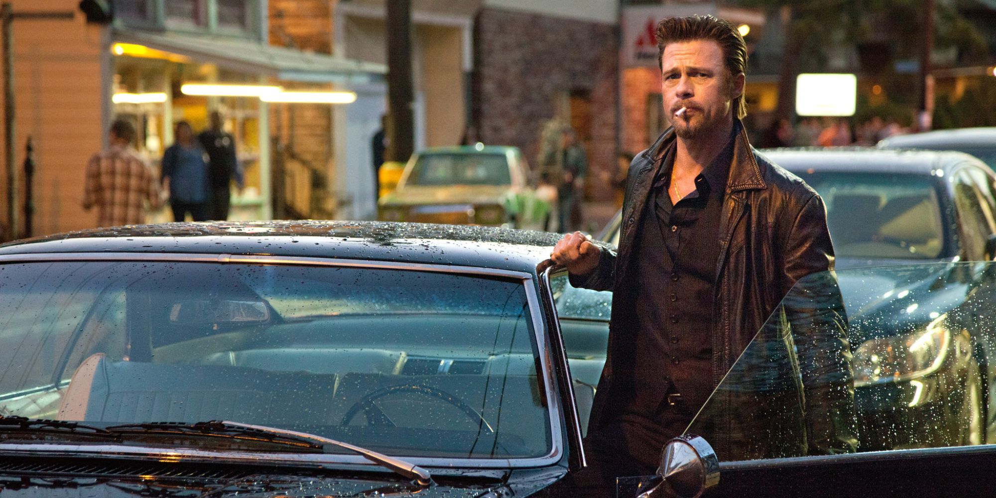 Brad Pitt as Jackie Cogan stepping out of a car and looking intently in &lsquo;Killing Them Softly&rsquo;