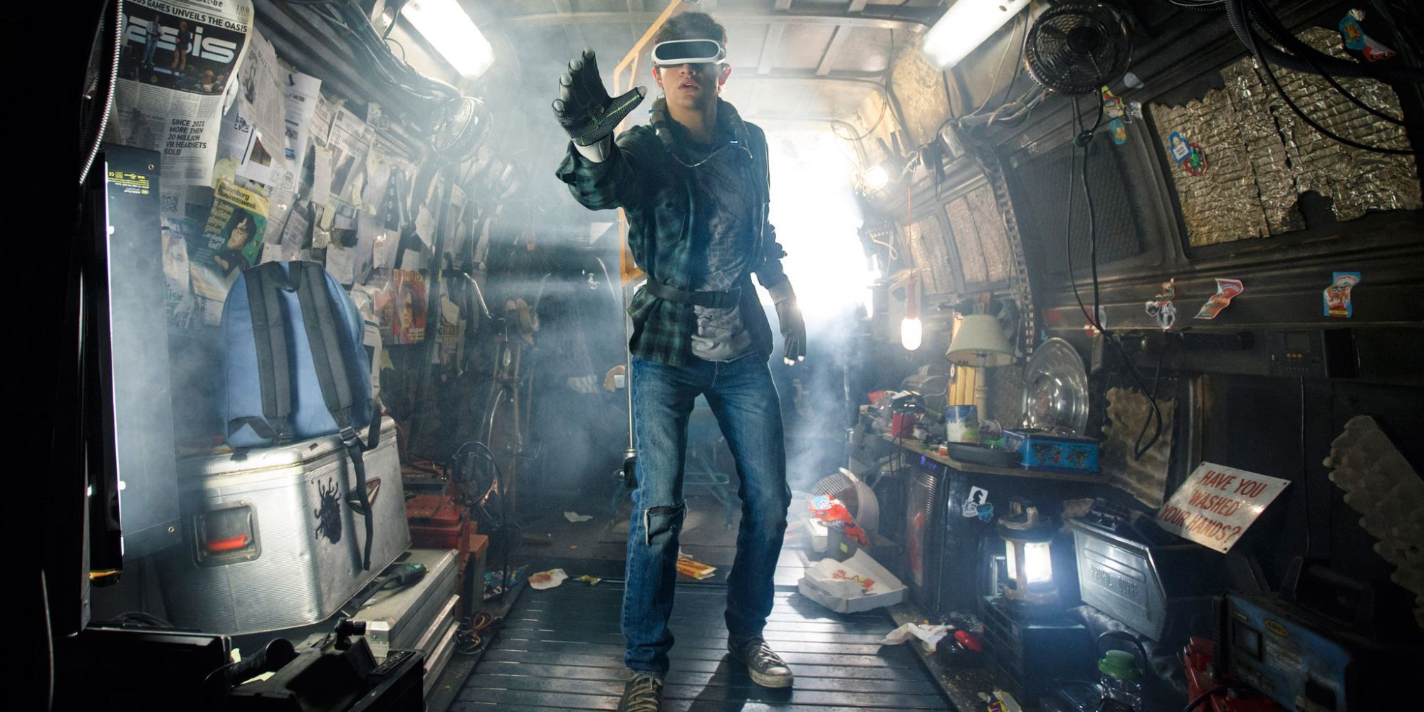 A teenage boy wears an advanced virtual reality set in the confines of a van in 'Ready Player One' (2018)