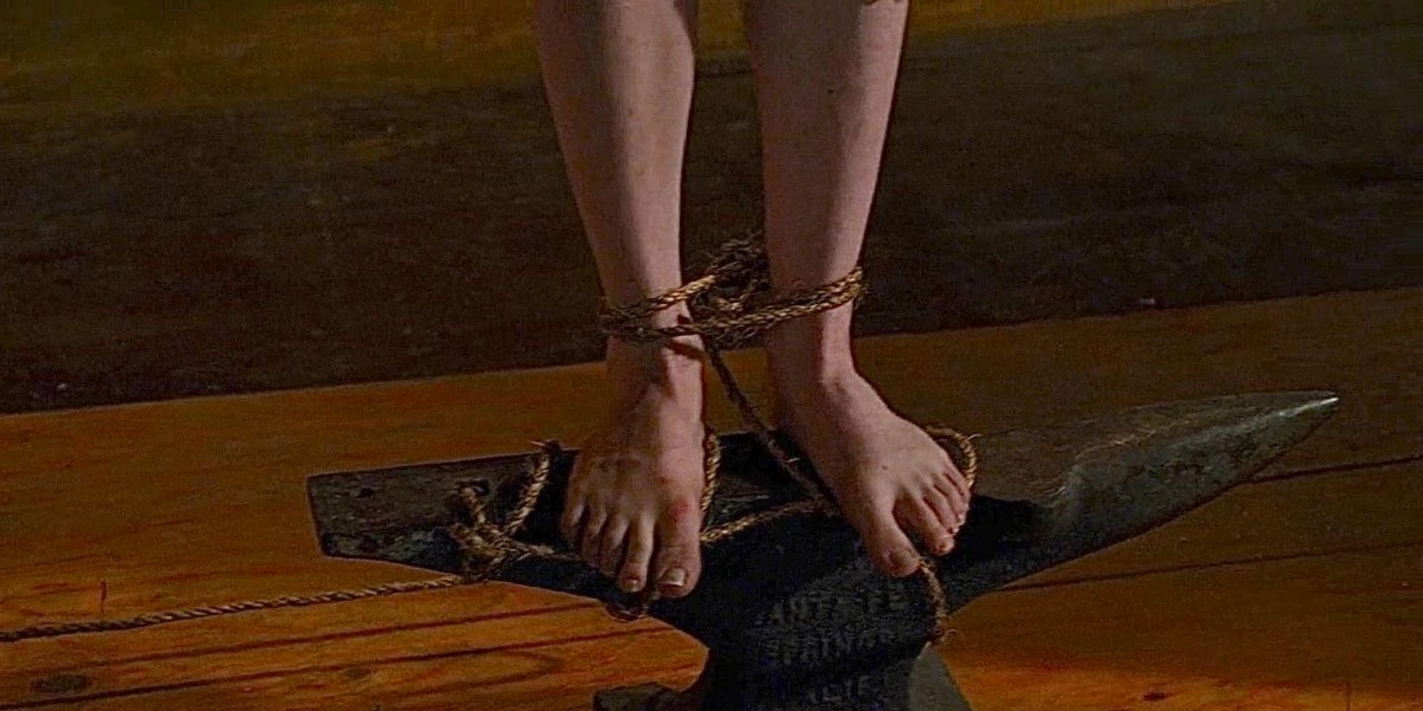 someone standing on steel with tied feet