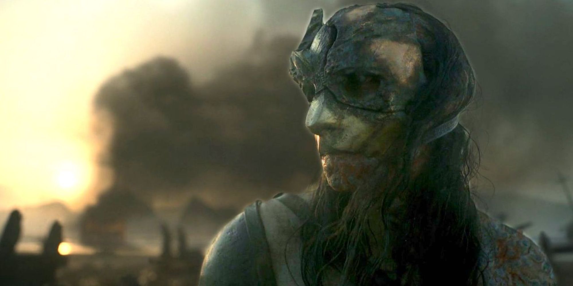 A man in mask admist a war