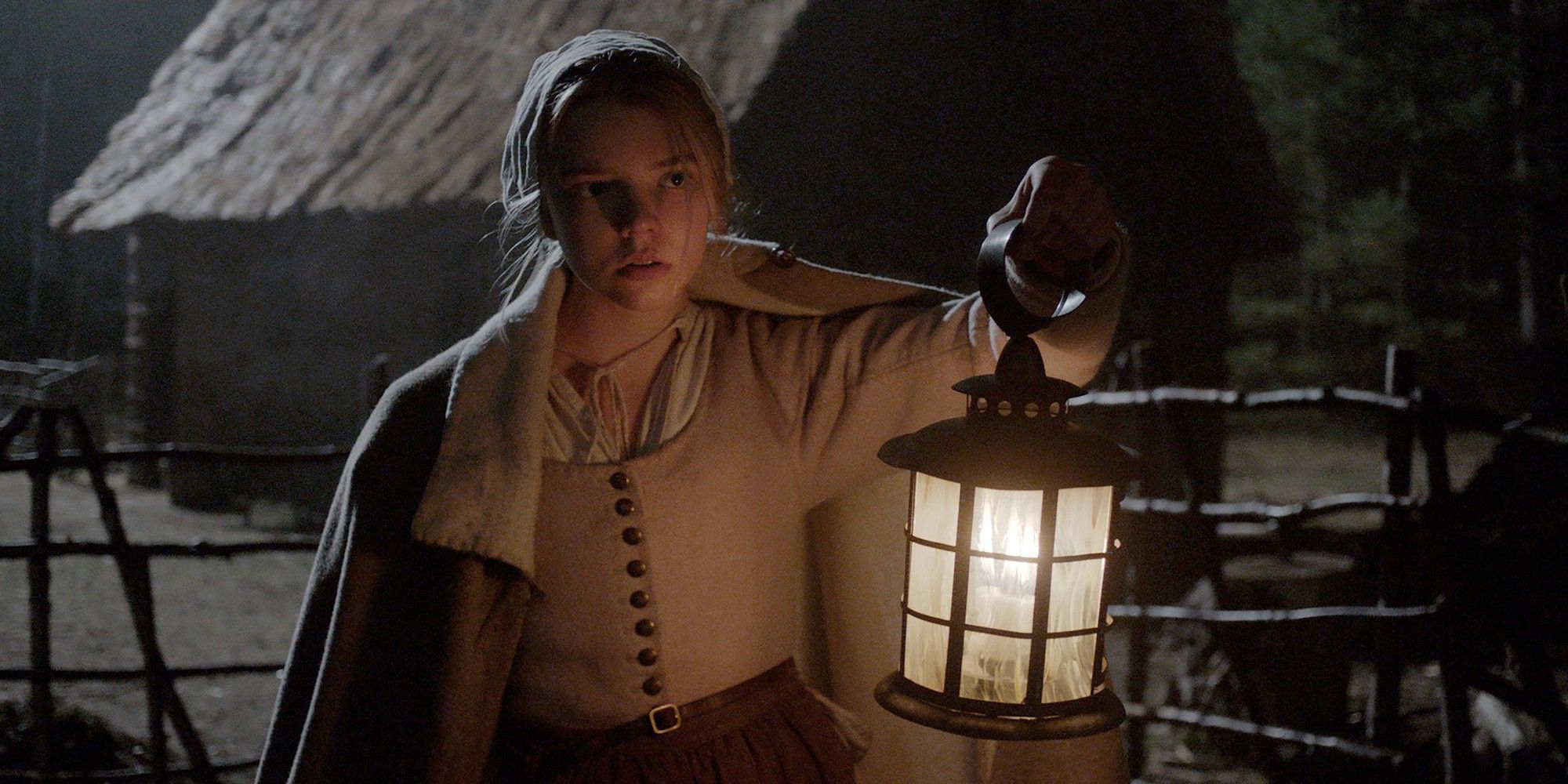 Anya Taylor-Joy holding a lantern in 'The Witch'