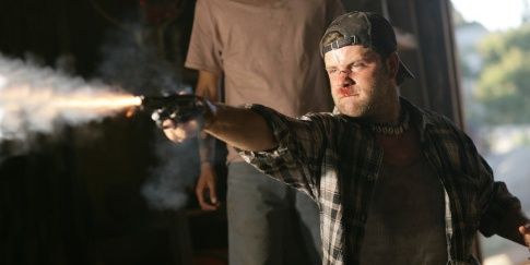 A man firing a gun in Borderland movie