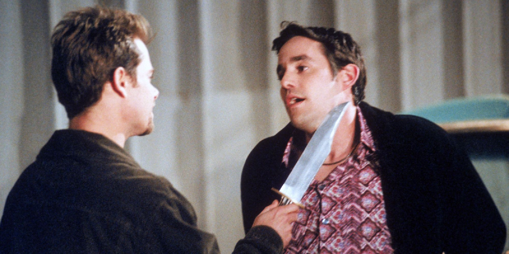 Xander Harris (Nicholas Brendon) with a knife to his throat in the 'Buffy the Vampire Slayer' episode "The Zeppo."