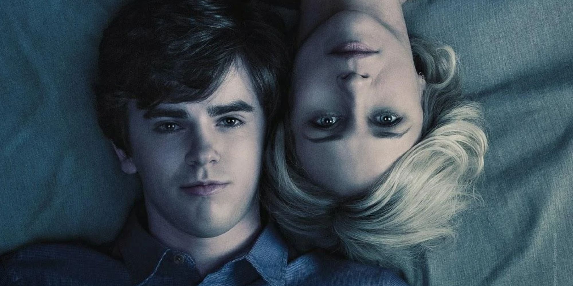 Norman and Norma Bates lying in bed together and looking up at the camera in Bates Motel.