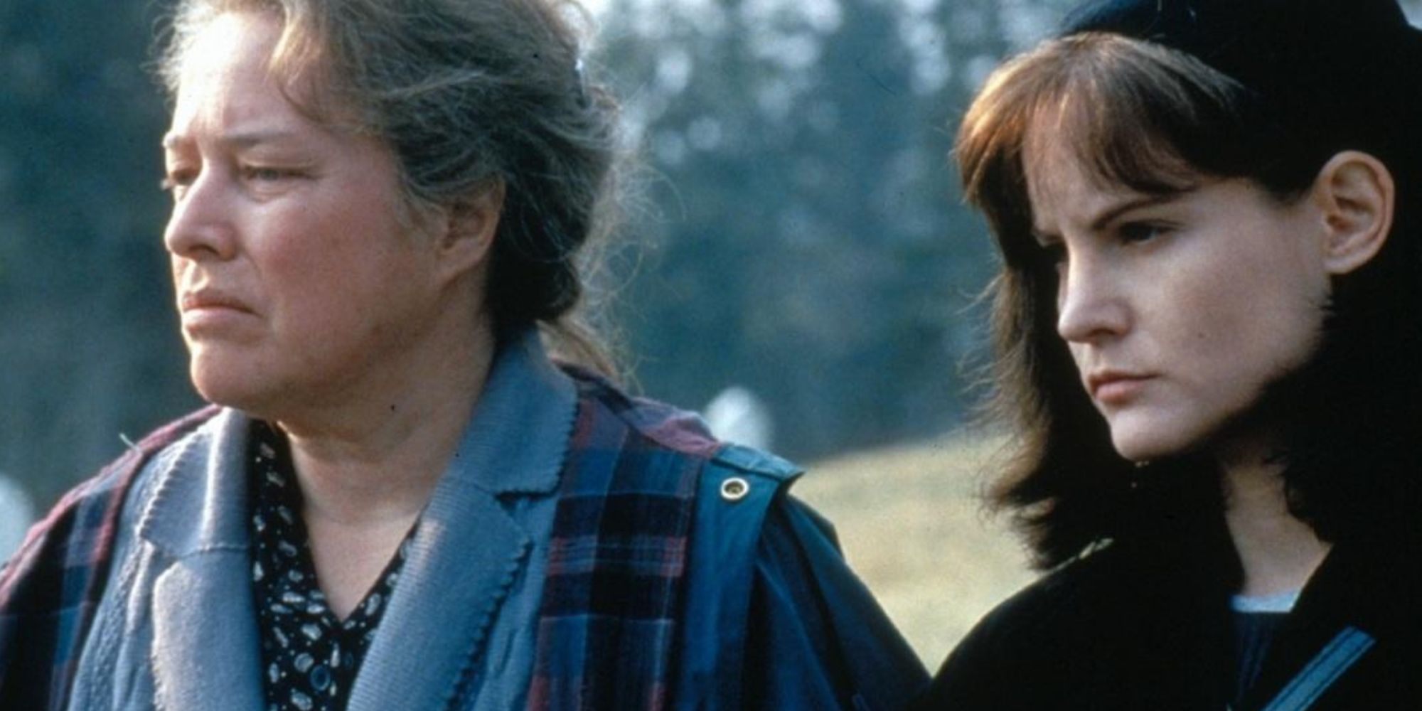 Kathy Bates and Jennifer Jason Leigh stare into the distance during a scene from the film Dolores Claiborne