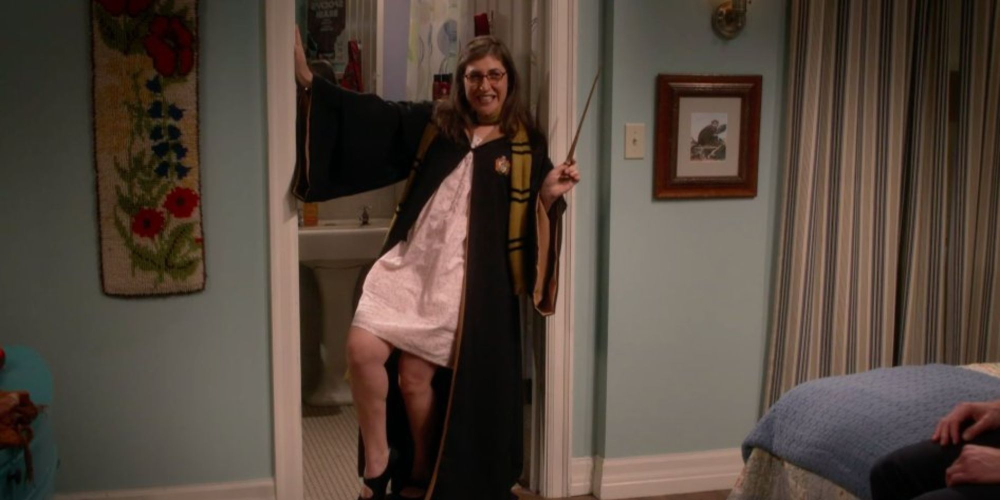 a girl dresses in harry potter costume and poses sexily 