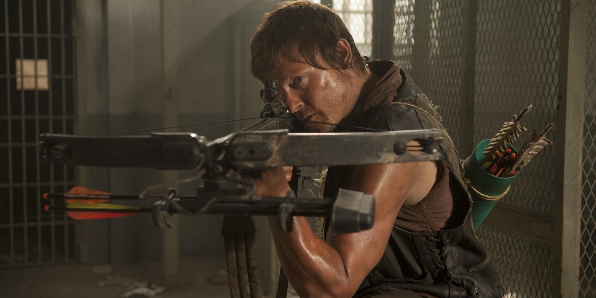 Zombie apocalypse survivor Daryl Dixon aims down the sights of his crossbow in 'The Walking Dead'.