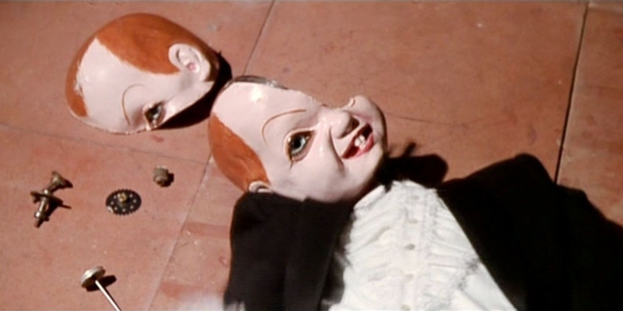 A broken doll on the floor in Deep Red (1975)