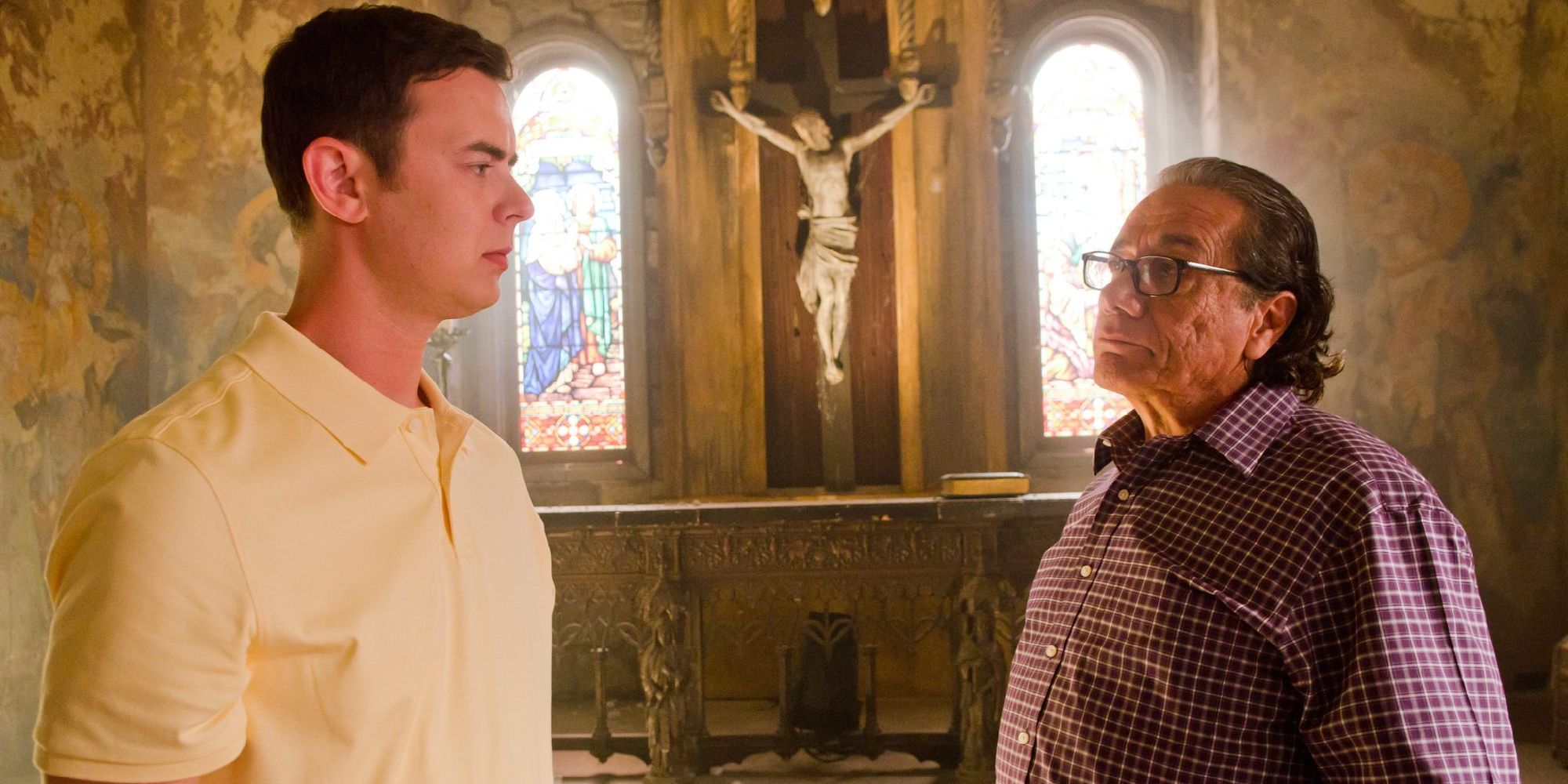 Colin Hanks and Edward James talking in front of a crucifix in Dexter