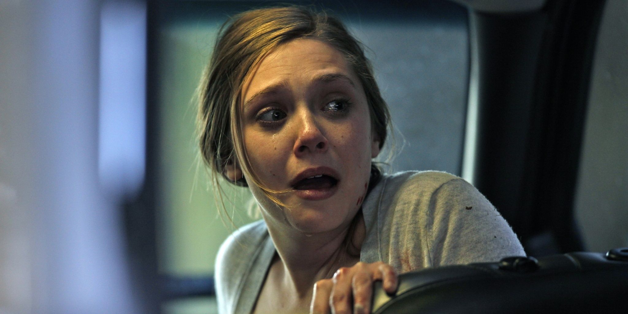 Elizabeth Olsen scared in a movie