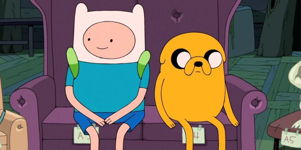 Finn and Jake sitting together in Adventure Time