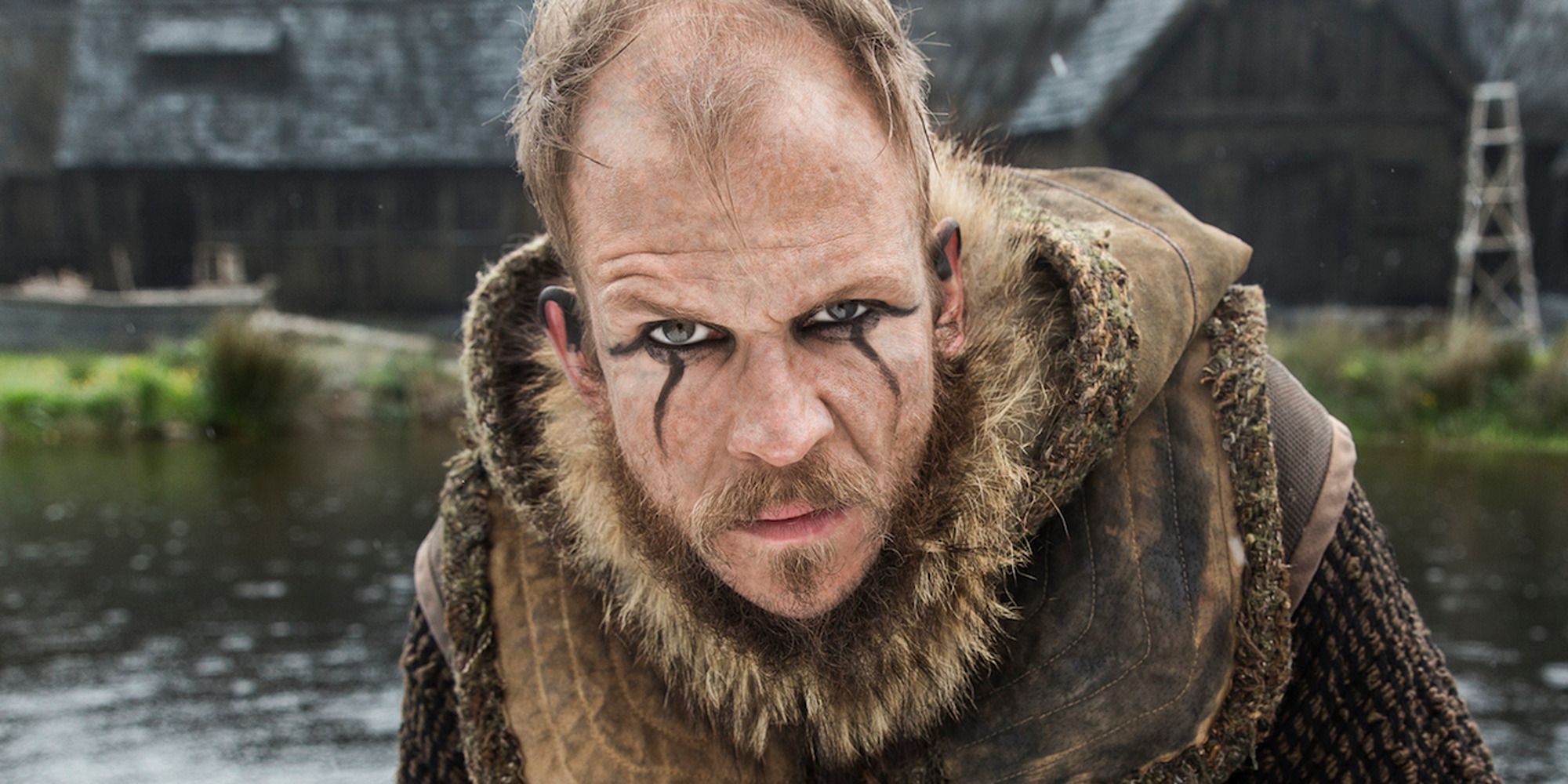 a viking with makeup looking at the camera